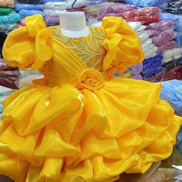 Premium Golden Yellow Baby Ball Gown with heavy pearl-beaded embroidery, puffed ruffle sleeves, and a 3D rose waistline