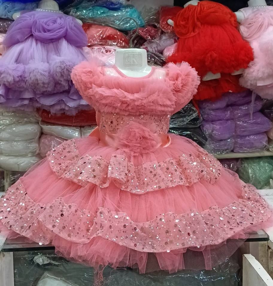 Premium Peach Shimmery Baby Dress Ball Gown with sequined ruffled layers, off-the-shoulder fluffy net design, and floral waist accent - HKD931 - Kiddleplace