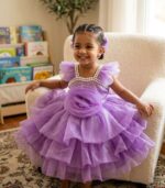 Lavender rose party dress for baby girl with pearl beaded neckline and tiered ruffled tulle.