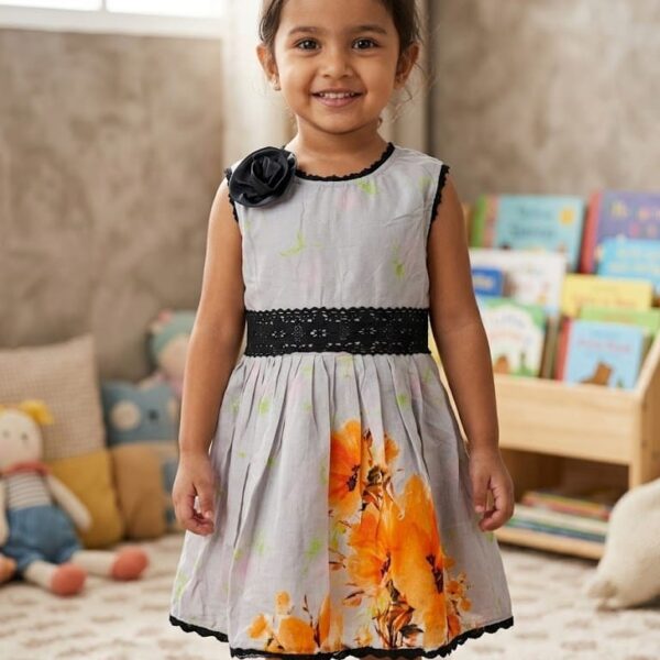 Little girl wearing a luxury black party dress featuring a large 3D rose motif, pearl-beaded neckline, and tiered ruffled tulle skirt.