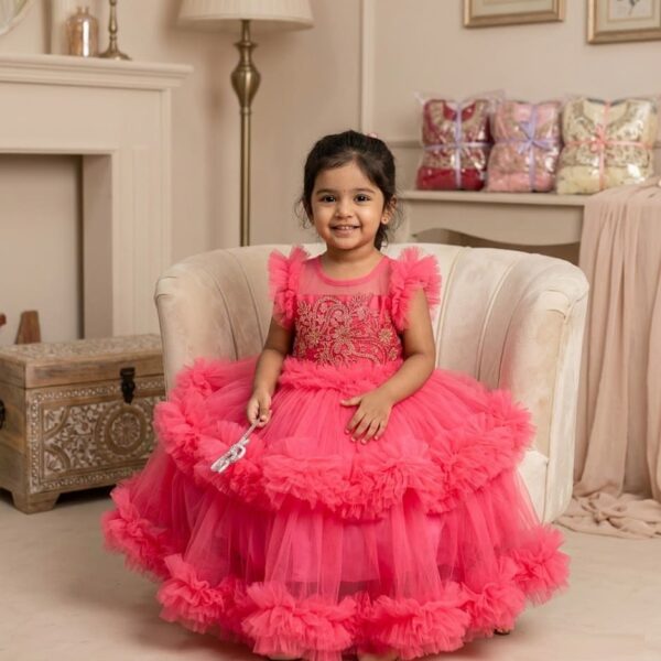 Pink ruffle party dress for girls with gold embroidery bodice and tiered net skirt