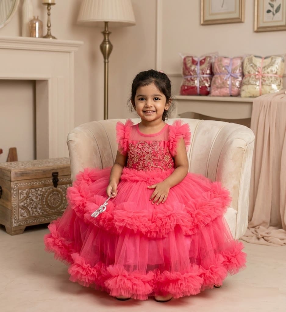 Pink ruffle party dress for girls with gold embroidery bodice and tiered net skirt